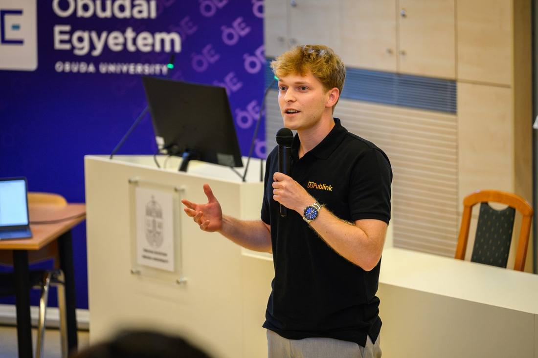 A student pitching on stage