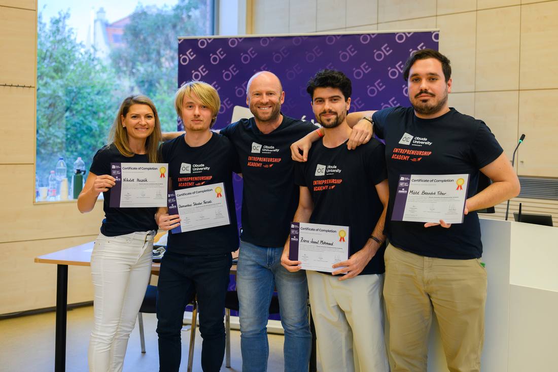 A team with their certificates of completion